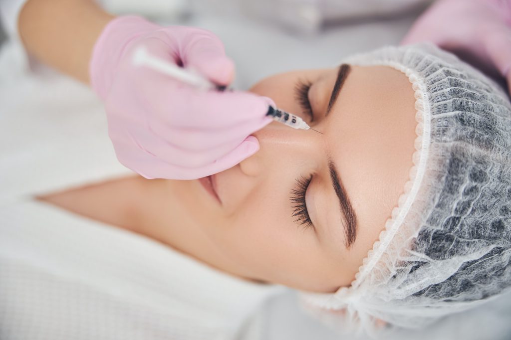 Face volume improvement with hyaluronic acid injection