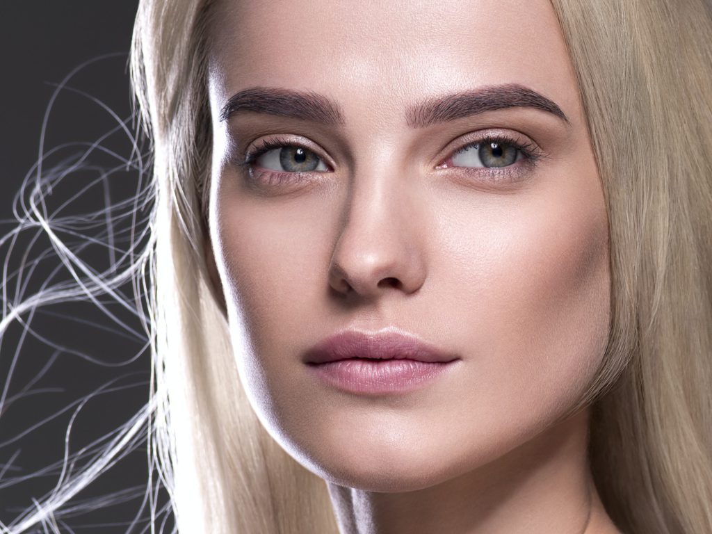 Natural make up blond hair woman close up face beauty portrait
